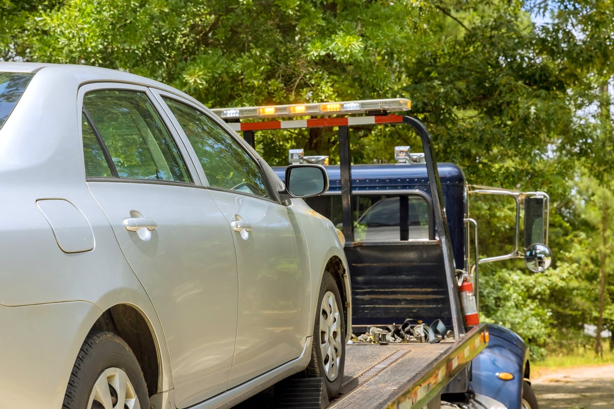 Tow truck transporting vehicle