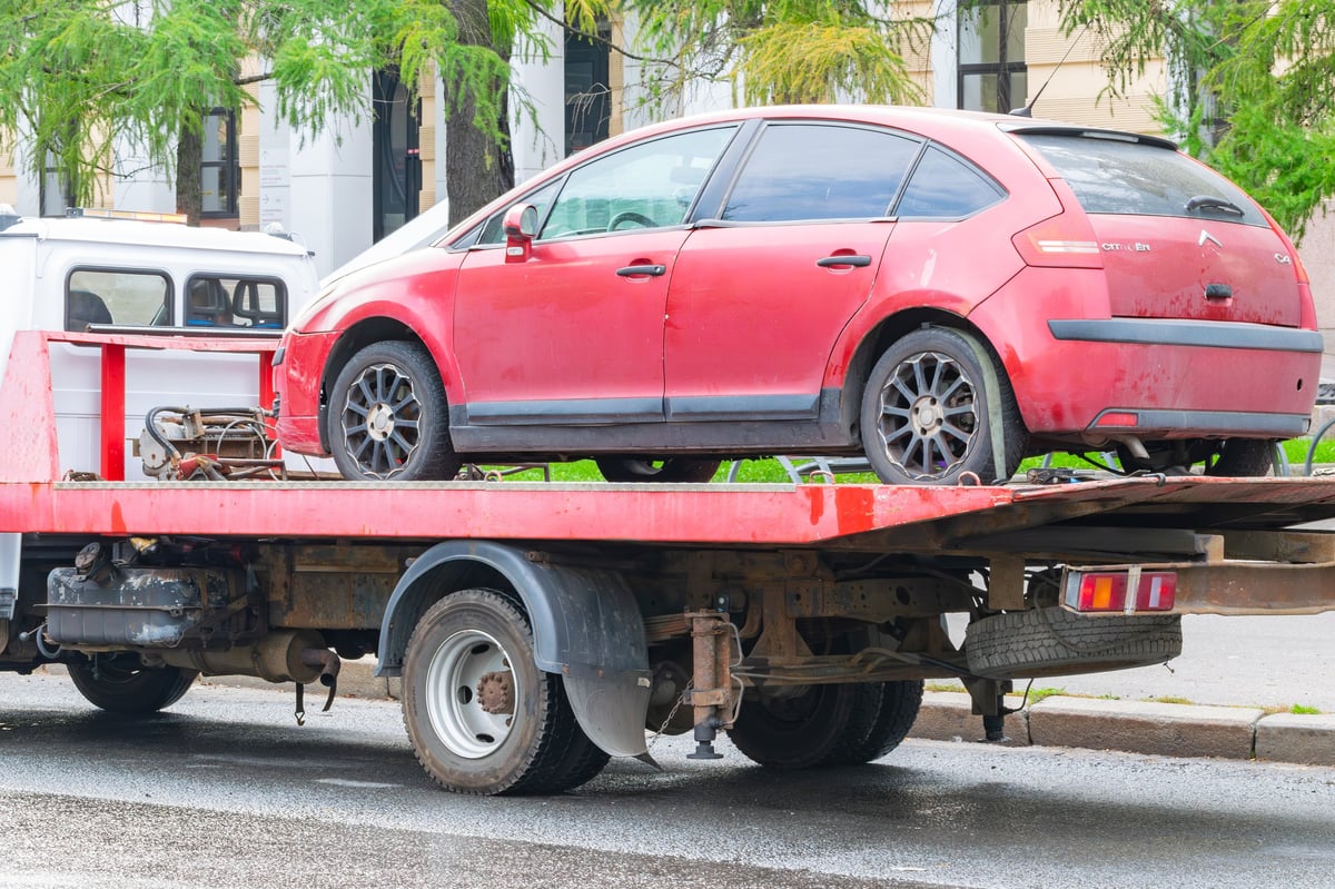 Car loaded onto tow truck